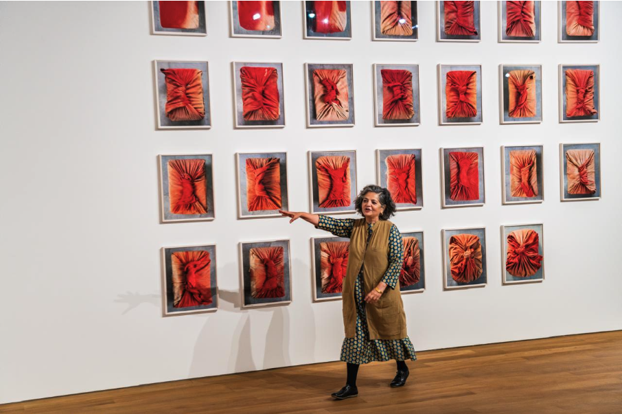 Dayanita Singh in front of artwork