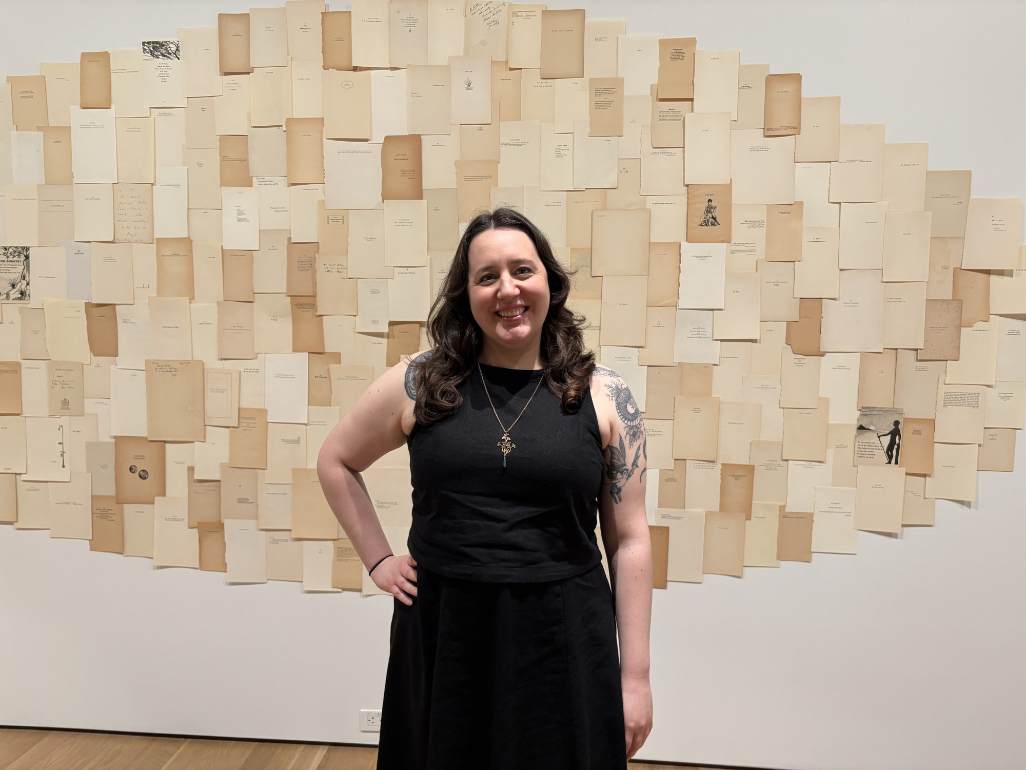 Allegra in front of exhibition wall