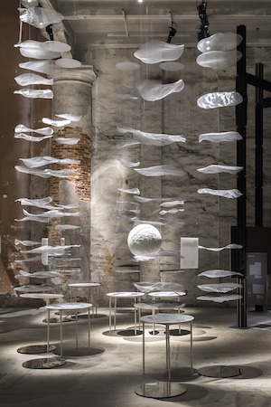 art work showing floating discs in dark room