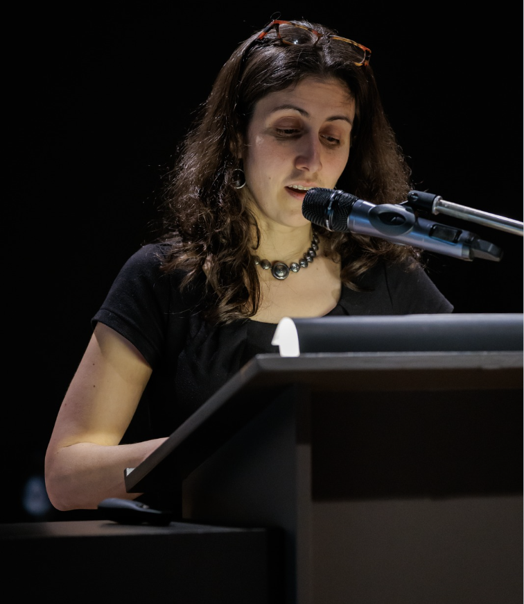 Abigail Newman at a podium