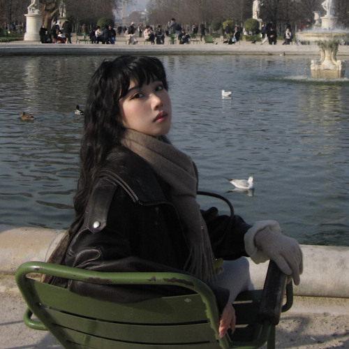 Shirley sitting in front of fountain